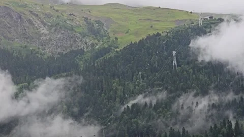 Mountains in Clouds Above a Summer Valley Stock Footage 330634553