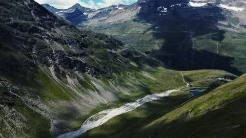 Mountains, clouds and green trees with Rivers Stock Photos