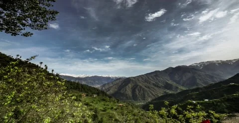 Mountains, clouds, blue sky, trees, greenery Timelapse Stock Footage 247133440