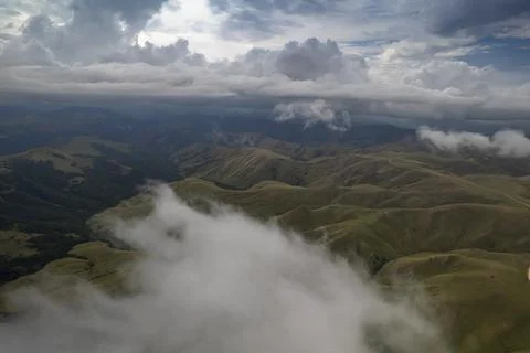Mountains in the clouds. Low clouds in the North Caucasus mountains Stock Photos