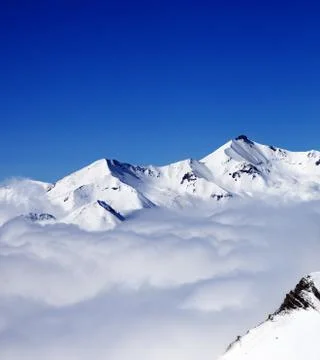 Mountains in clouds at nice day Stock Photos