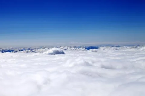 Mountains in clouds at nice sun day Stock Photos