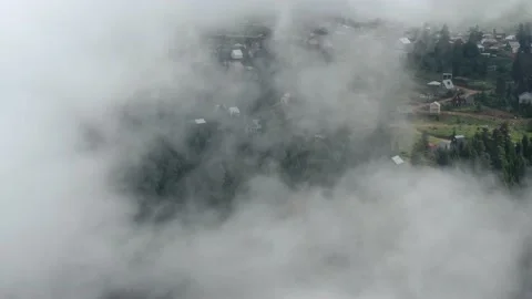 Mountains in clouds, View from drone above clouds of mountain village Vídeo Stock 237613472