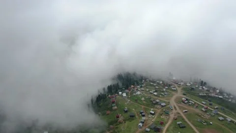 Mountains in clouds, View from drone above clouds of mountain village 库存影片 237613567