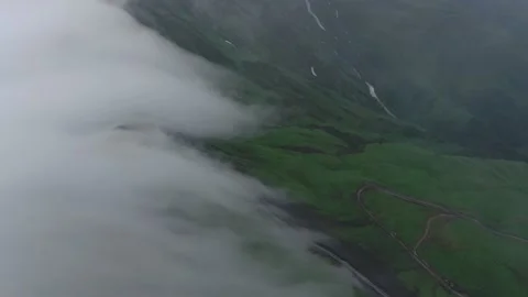 Mountains in clouds, View from drone above clouds of mountain village 库存影片 237774521