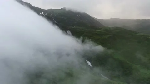 Mountains in clouds, View from drone above clouds of mountain village Stock Footage 237774738
