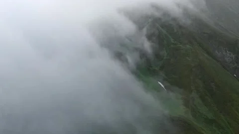 Mountains in clouds, View from drone above clouds of mountain village Vídeo Stock 237774834