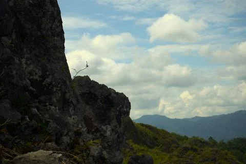 Mountains with cloudy sky background Stock Photos