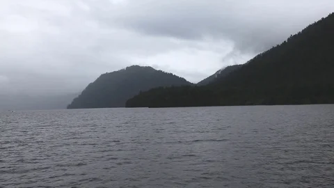 Mountains covered with clouds on the lake Stock-Footage 71486463