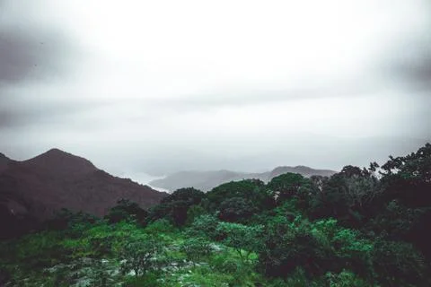 Mountains covered with raining clouds at the top of the mountain Stock Photos