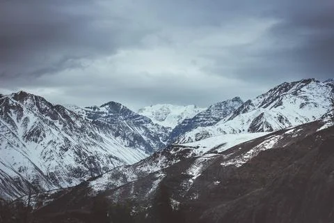 Mountains covered in snow one after another for many kilometers Stock Photos
