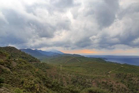 Mountains of Datca with clouds during sunset Stock Photos