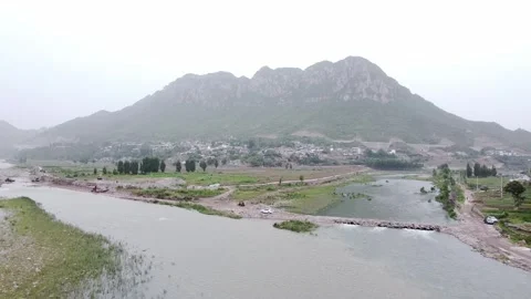 The mountains in the distance and the river close by Stock Footage 247363559