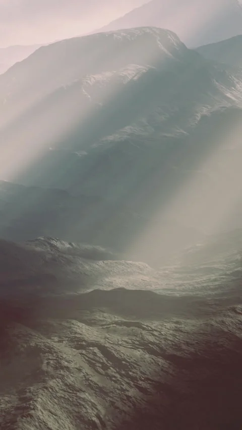 Mountains in the distance with light shining through the clouds at dawn Stock Footage 336010449