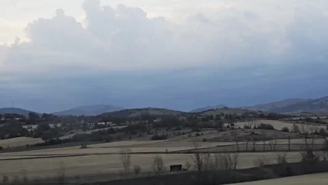Mountains in the distance with a red. Video stock 282661057