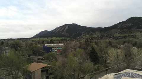 Mountains down to library - Drone camera moves back and up Stock Footage 138873940