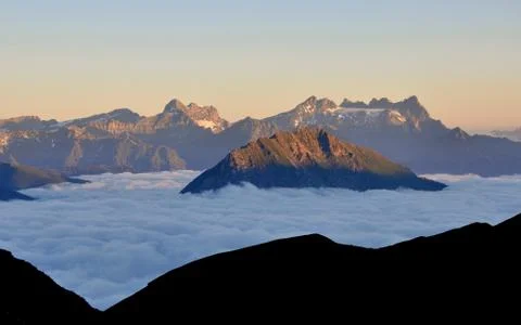 Mountains drown in white clouds Stock Photos