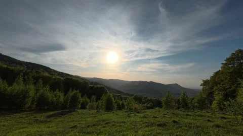 Mountains during cinematic beautiful warm spring sunset Stock Footage 329567460
