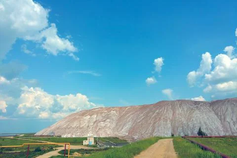 Mountains of empty ore when mining potassium. Mining industry in Soligorsk, B Stock Photos