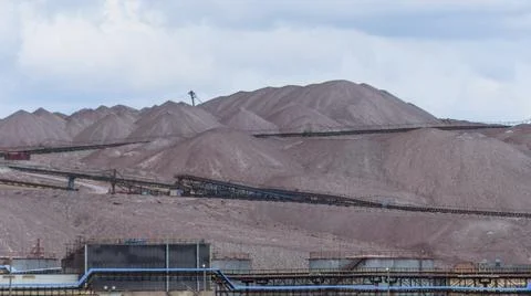 Mountains of empty ore when mining potassium. Transportation of an empty rock Stock Photos