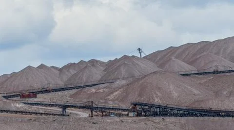 Mountains of empty ore when mining potassium. Transportation of an empty rock Stock Photos