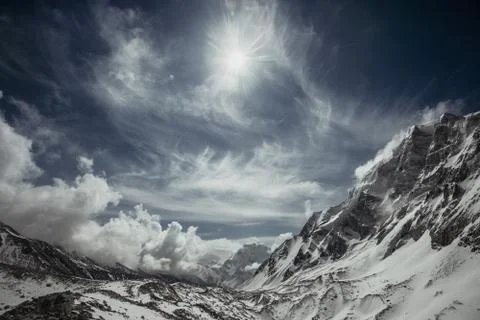 Mountains in evening cloudy sky Stock Photos