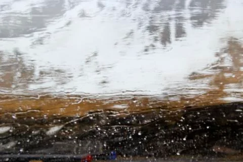 Mountains falling away with rain Photos