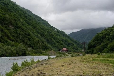 Mountains, field, river and cloudy, cloudy sky, Georgia Stock Photos