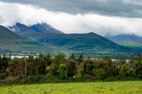 Mountains, Fields and Lake on Cloudy Day in Killarney Ireland Stock Photos