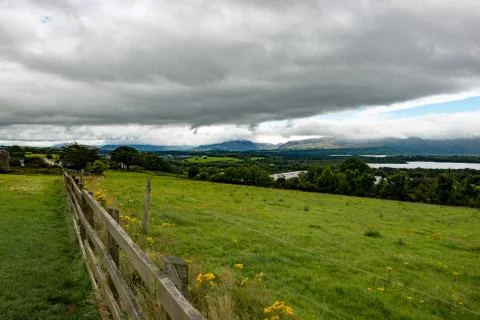 Mountains, Fields and Lake on Cloudy Day in Killarney Ireland Stock Photos