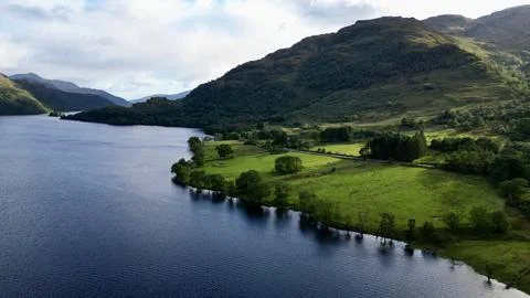Mountains, Fields and Trees beside a Lake - Loch Lomond, Scotland Stock Photos