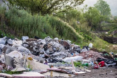 Mountains of garbage in nature. Stock Photos