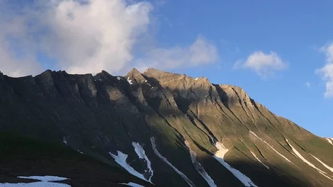 Mountains going into shade. Timelapse. Blue sky, clouds. Georgia, Caucasus. Stock Footage 115530389