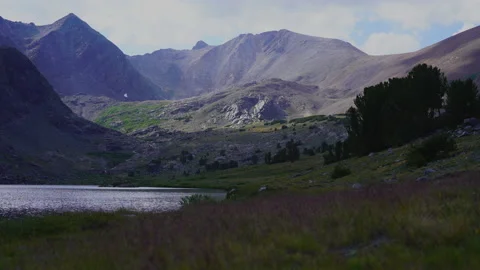 Mountains with grass in foreground Stock Footage 158663420