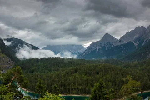 The mountains, green fields, meadows and forests Stock Photos