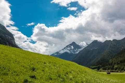 The mountains, green fields, meadows and forests Stock Photos