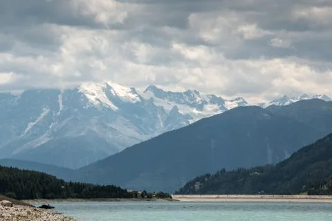 The mountains, green fields, meadows and forests near by the lake Photos