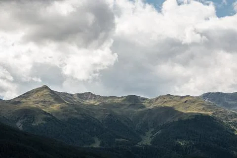 The mountains, green fields, meadows and forests Stock Photos