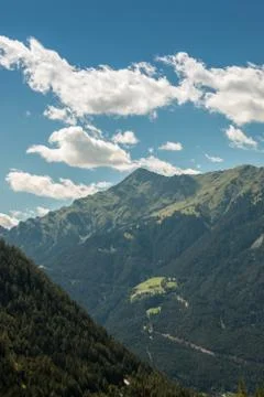 The mountains, green fields, meadows and forests Stock Photos