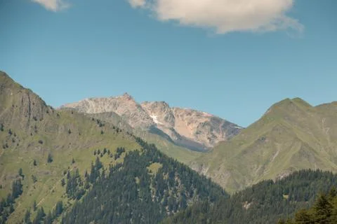 The mountains, green fields, meadows and forests Stock Photos