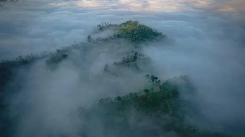Mountains hidden by the fog Stock Photos
