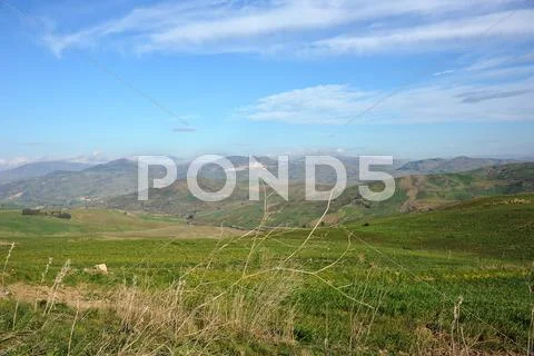 Mountains, hills and clouds Stock Photos
