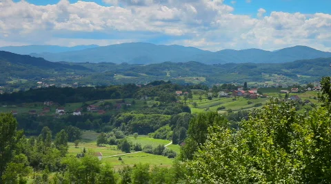 Mountains hills meadow clouds timelaps Stockbeeldmateriaal 800843