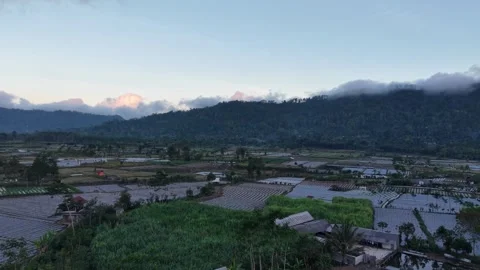 Mountains loom behind misty valleys Stock Footage 346254180