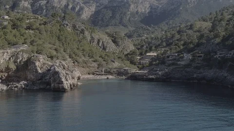 Mountains, native forest and rocky cost at north Mallorca, drone shot, Raw in 4K Stock Footage 89893318