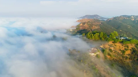 Mountains nature at sunrise, clouds floating above scenic green hills at Malibu Stock Footage 135288436