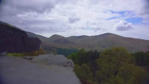 Mountains with out of focus rocks Видео 75590246