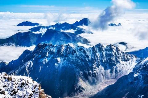 The mountains over the clouds Stock Photos