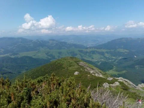 Mountains peak with green fields Stock Photos