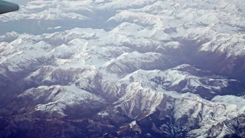 Mountains from plane window Stock Footage 148991012